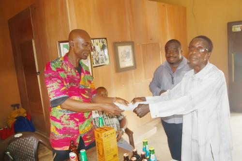 The Adure and Onyima Obioharepresentative receiving the signed papers from Ndiucheagwu Community head.